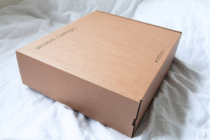 Organic hemp bed set in natural colour. Sustainable, biodegradeable packaging